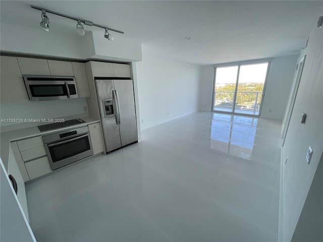 kitchen featuring stainless steel appliances and track lighting