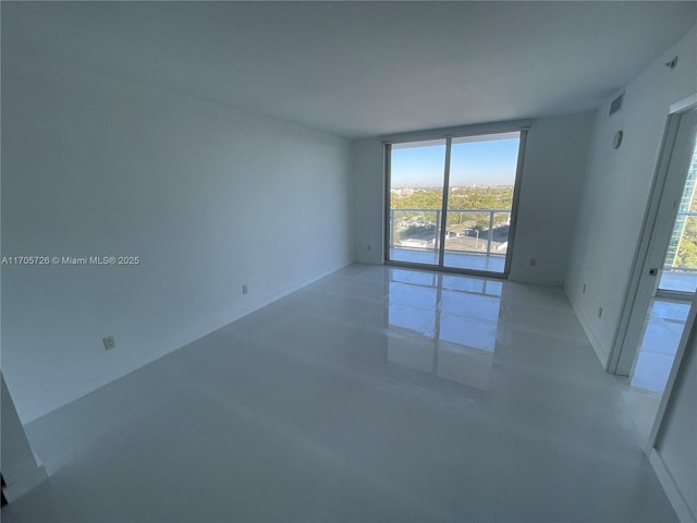 empty room with concrete flooring