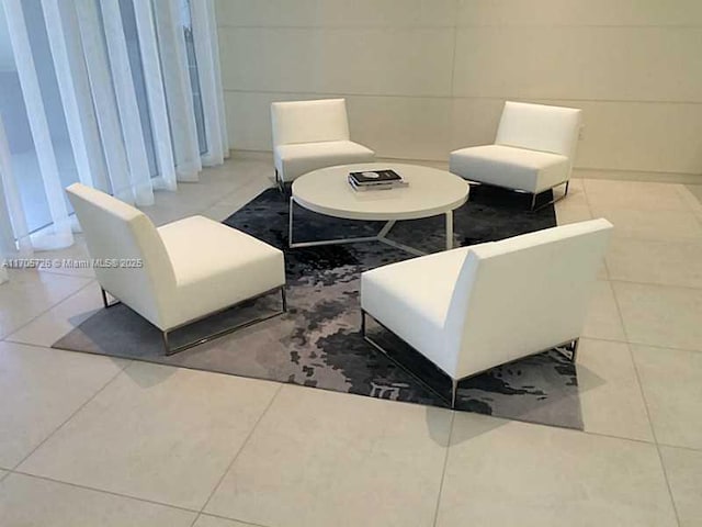 living area featuring tile patterned floors