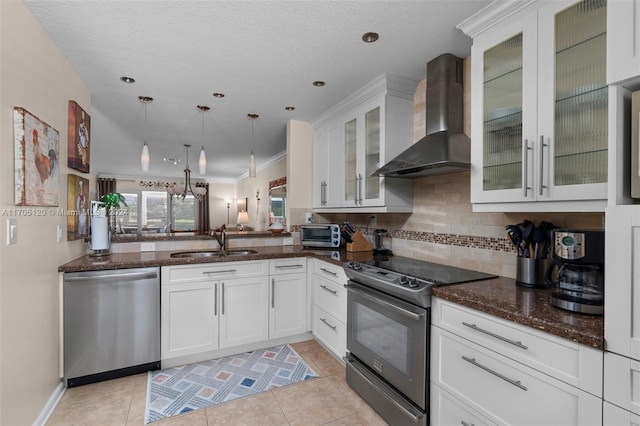 kitchen with sink, stainless steel dishwasher, wall chimney exhaust hood, black / electric stove, and white cabinetry