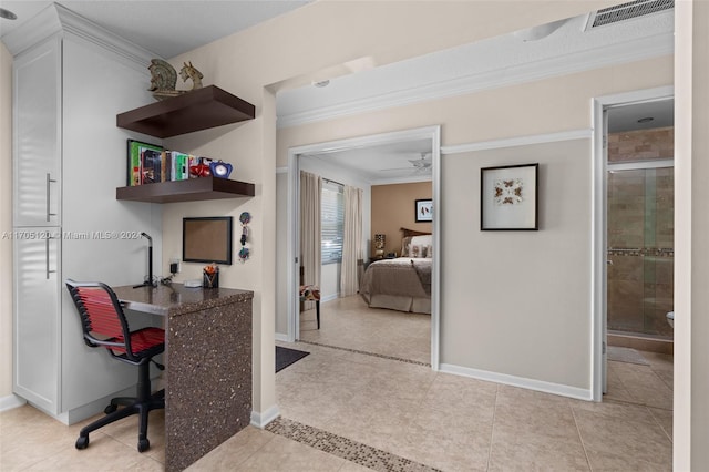 office area with ceiling fan, ornamental molding, and light tile patterned floors