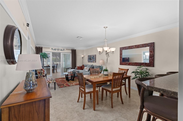 dining space with crown molding and a chandelier