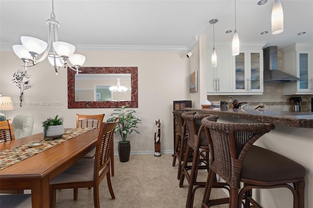 tiled dining area with crown molding and an inviting chandelier