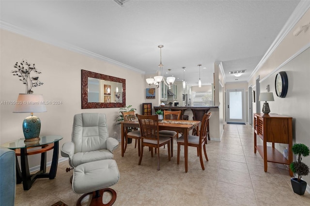 tiled dining space featuring a chandelier and ornamental molding