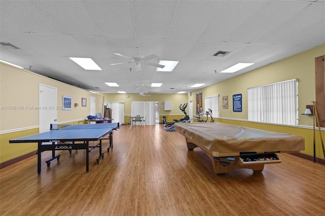 recreation room featuring a paneled ceiling, ceiling fan, hardwood / wood-style floors, and billiards