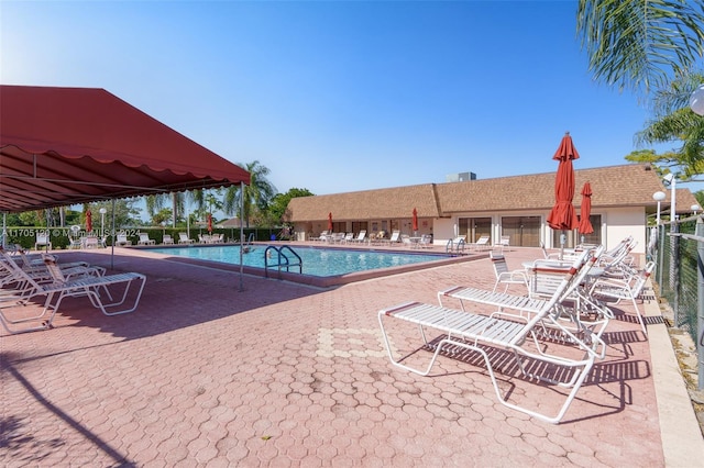 view of swimming pool with a patio