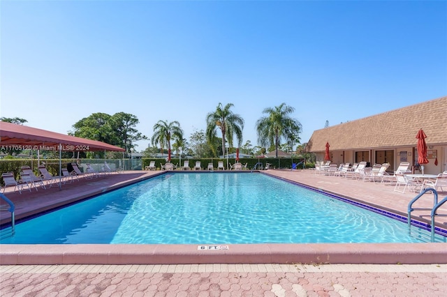 view of swimming pool with a patio area