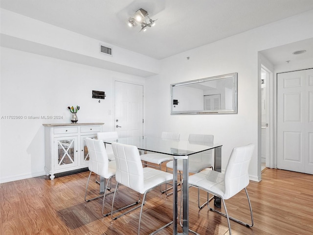 dining room with light hardwood / wood-style flooring