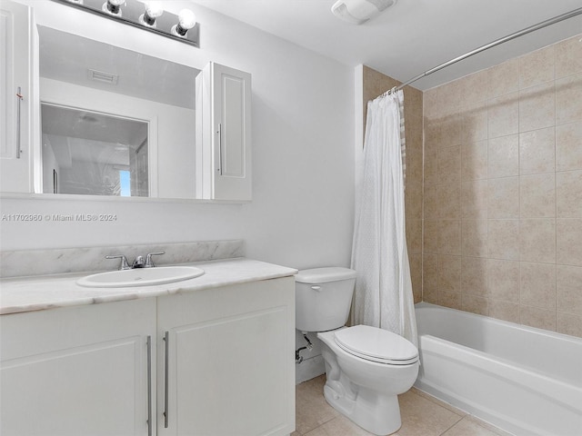 full bathroom with tile patterned flooring, shower / bath combo, toilet, and vanity