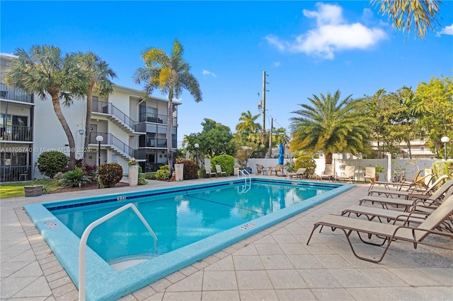 view of swimming pool with a patio area