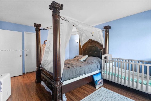 bedroom featuring dark wood-type flooring