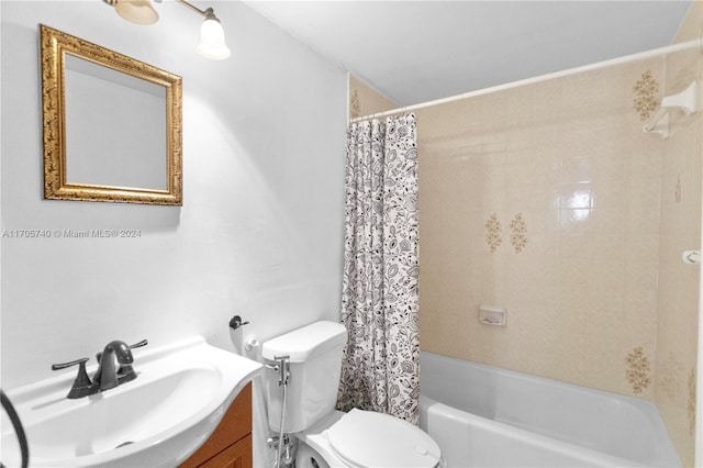 full bathroom with vanity, toilet, and shower / bath combo with shower curtain