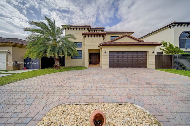 mediterranean / spanish house featuring a garage