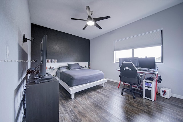 bedroom featuring ceiling fan and dark wood-type flooring