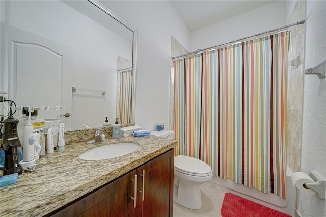 full bathroom featuring tile patterned floors, vanity, shower / bath combination with curtain, and toilet