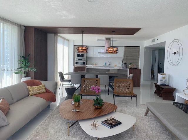330 Sunny Isles Blvd Unit 5-2407, Sunny Isles Beach, FL 33160 - living area featuring a textured ceiling