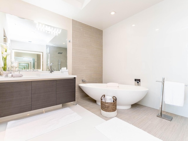 330 Sunny Isles Blvd Unit 5-2407, Sunny Isles Beach, FL 33160 - full bathroom with vanity, a stall shower, a freestanding bath, and tile walls