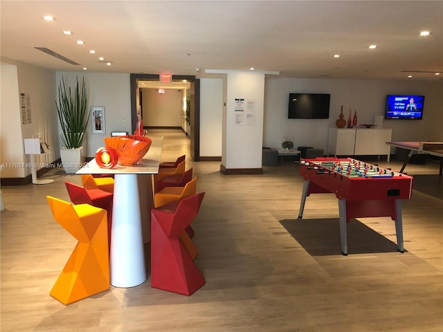 game room featuring light wood-type flooring