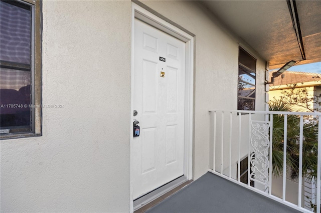 doorway to property featuring a balcony