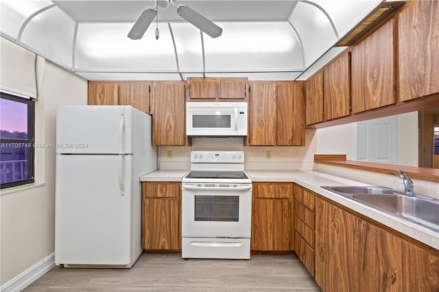 kitchen with ceiling fan, light hardwood / wood-style floors, white appliances, and sink