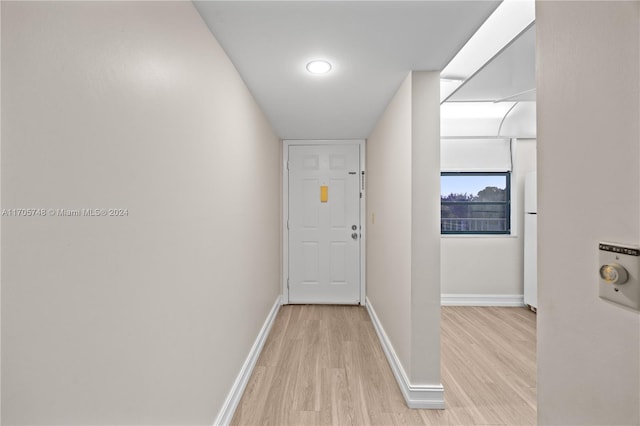 corridor featuring light hardwood / wood-style floors