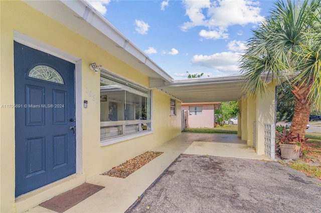 entrance to property with a carport