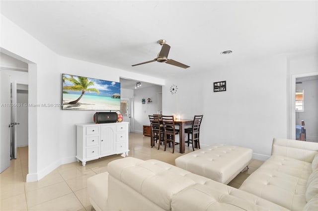 living room featuring ceiling fan and light tile patterned floors