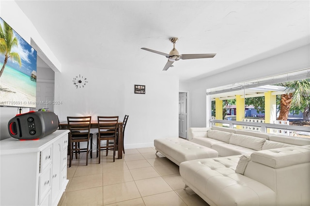 living room featuring ceiling fan and light tile patterned flooring