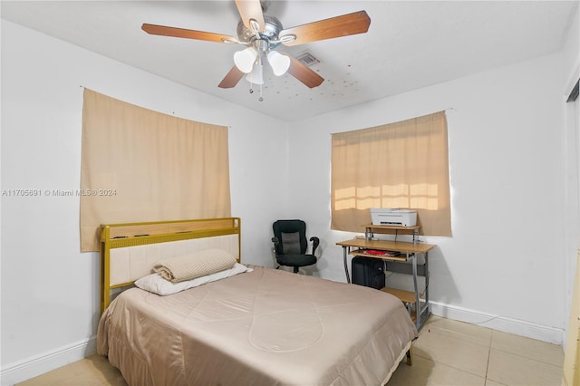 bedroom featuring ceiling fan and light tile patterned floors