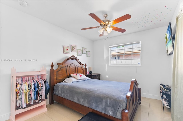 tiled bedroom with ceiling fan