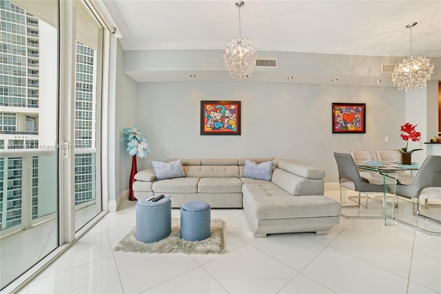 living room with a chandelier, tile patterned flooring, and crown molding