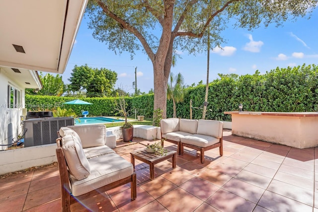 view of patio featuring an outdoor hangout area and central air condition unit