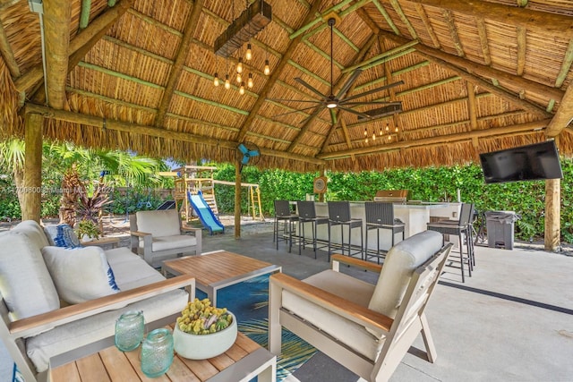 view of patio with a gazebo, an outdoor hangout area, and an outdoor bar