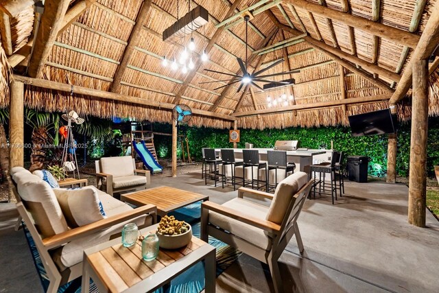 view of patio featuring a gazebo, an outdoor living space, and an outdoor bar