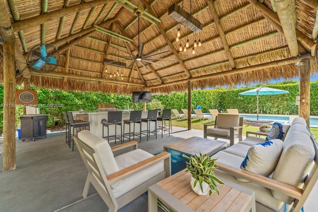 view of patio featuring a gazebo and an outdoor bar