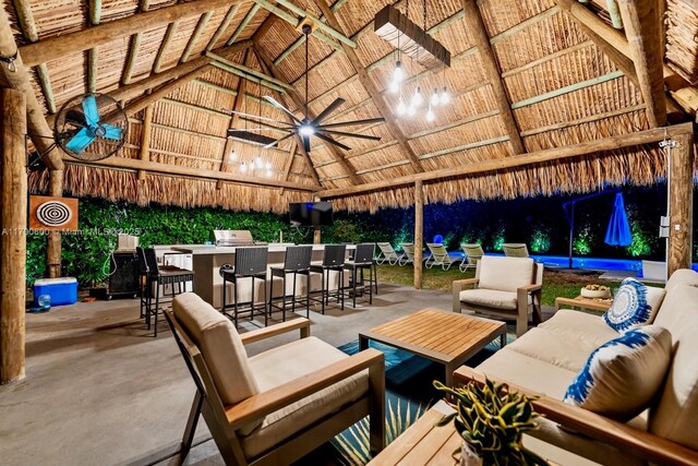 view of patio with a gazebo, an outdoor living space, ceiling fan, and exterior bar