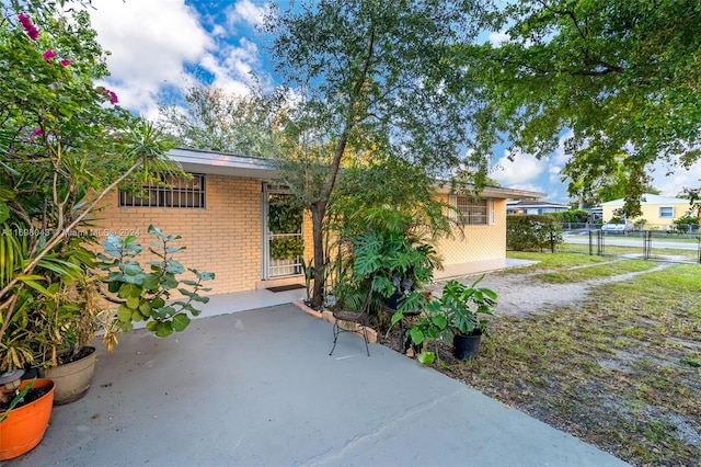 view of property exterior with a patio