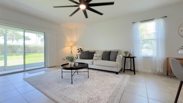 tiled living room featuring ceiling fan