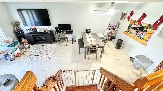 living room featuring tile patterned flooring and ceiling fan