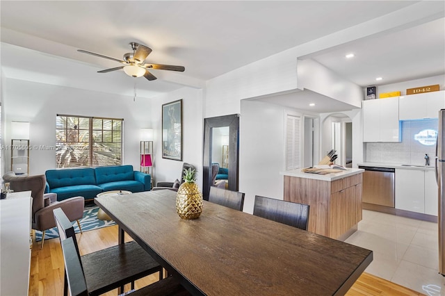 dining area featuring ceiling fan and light hardwood / wood-style flooring