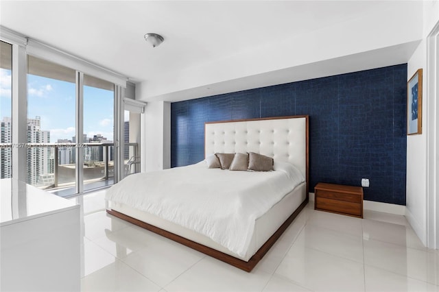 bedroom featuring access to exterior and tile patterned floors