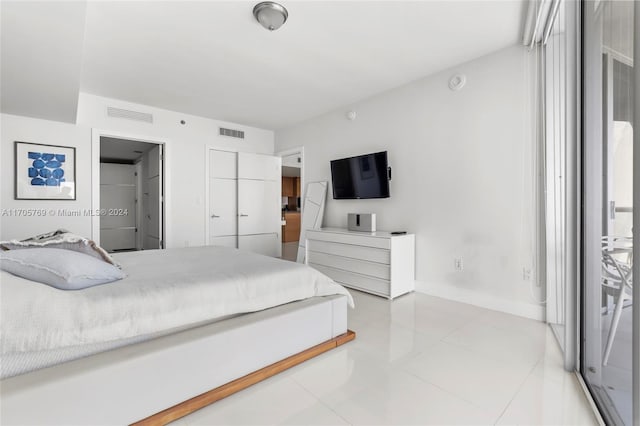 bedroom with tile patterned floors