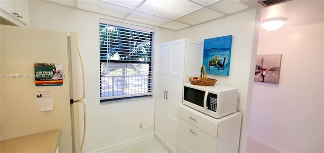 entryway with a drop ceiling