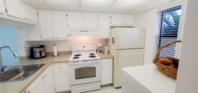 kitchen with white cabinetry, sink, range hood, white appliances, and a paneled ceiling