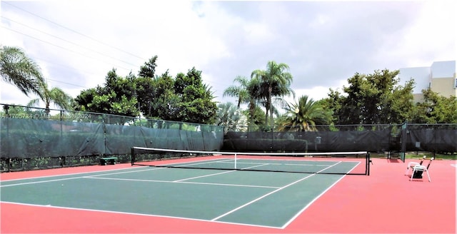 view of sport court with basketball hoop
