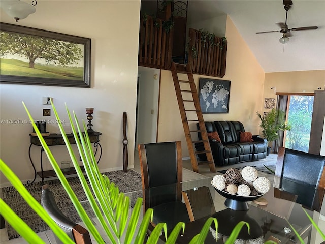 dining area featuring tile patterned flooring, high vaulted ceiling, and ceiling fan