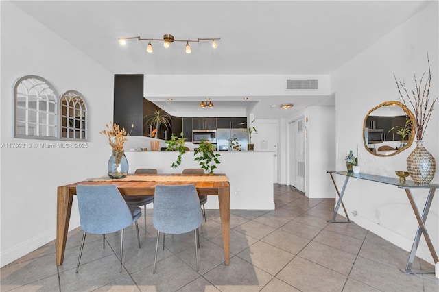 view of tiled dining space