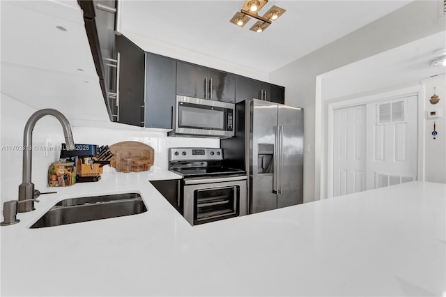 kitchen featuring appliances with stainless steel finishes and sink