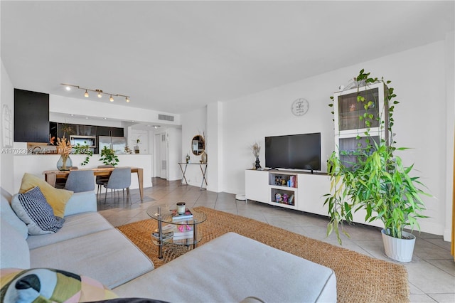 living room with tile patterned flooring