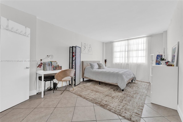 bedroom featuring light tile patterned flooring